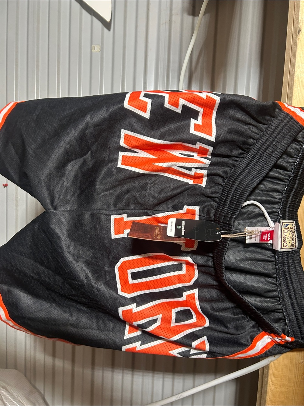 Men's Black Athletic Shorts with Orange Lettering - Unbranded